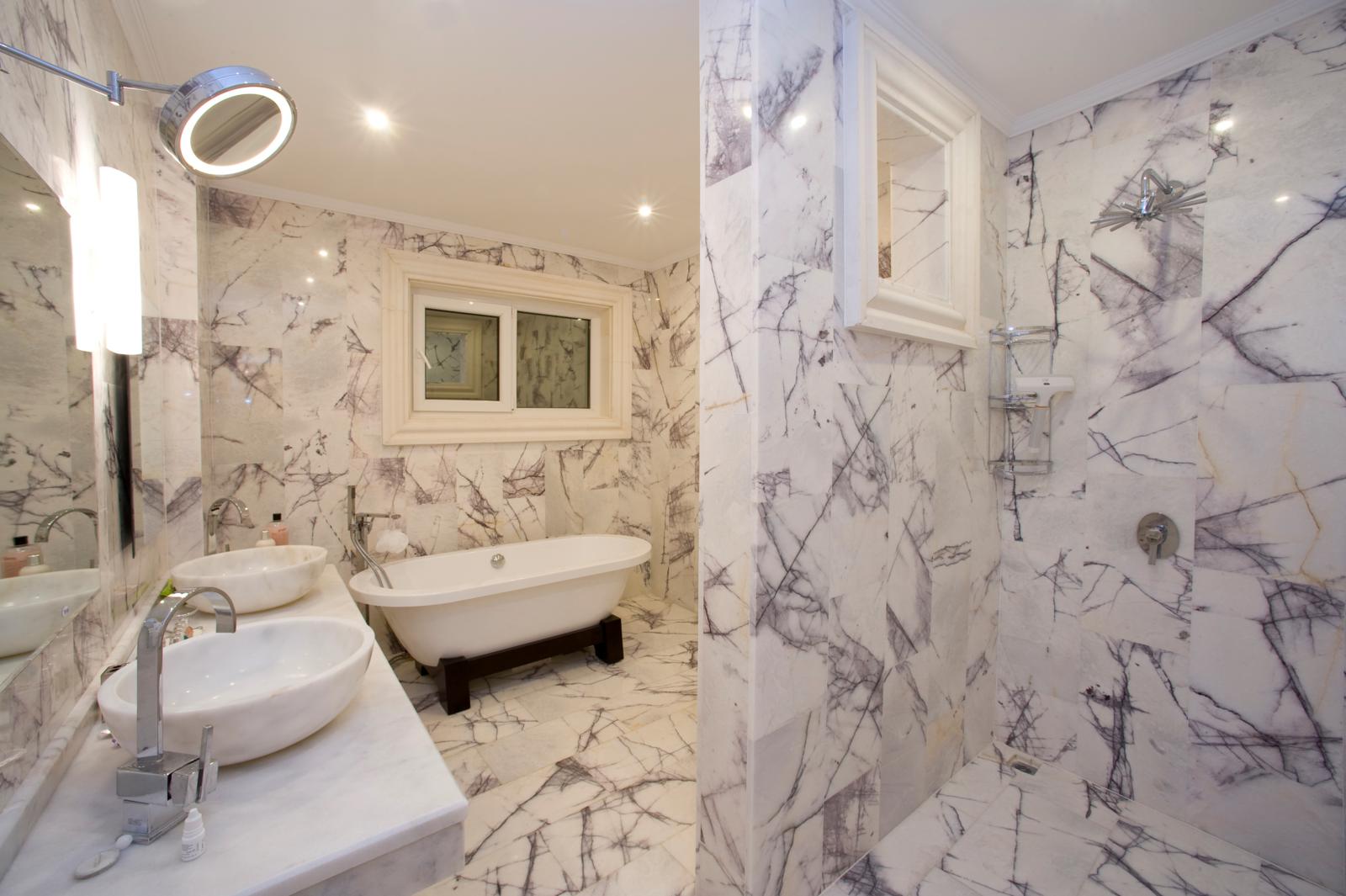 En-suite marble bathroom with double basins